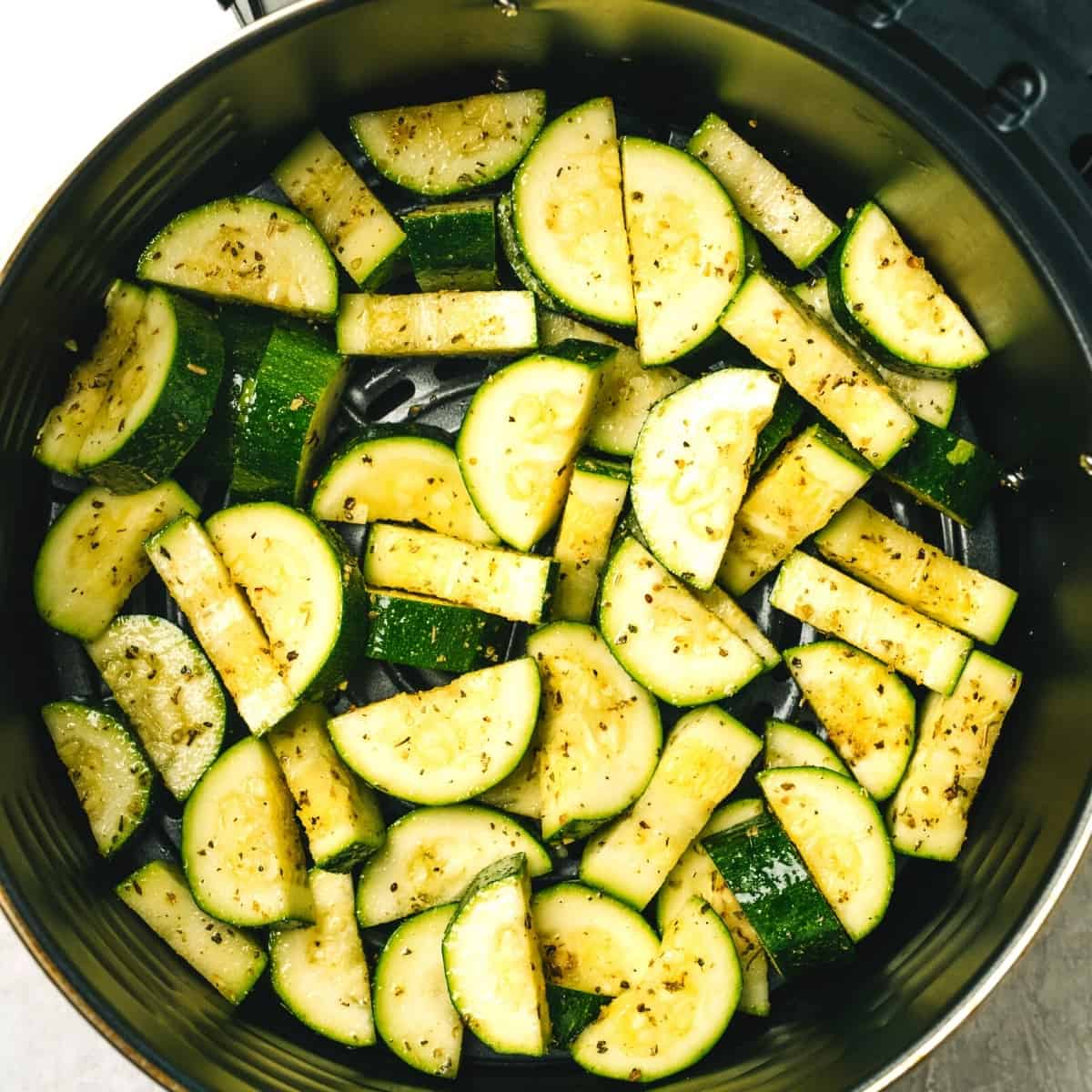 close up of zucchini in an air fryer