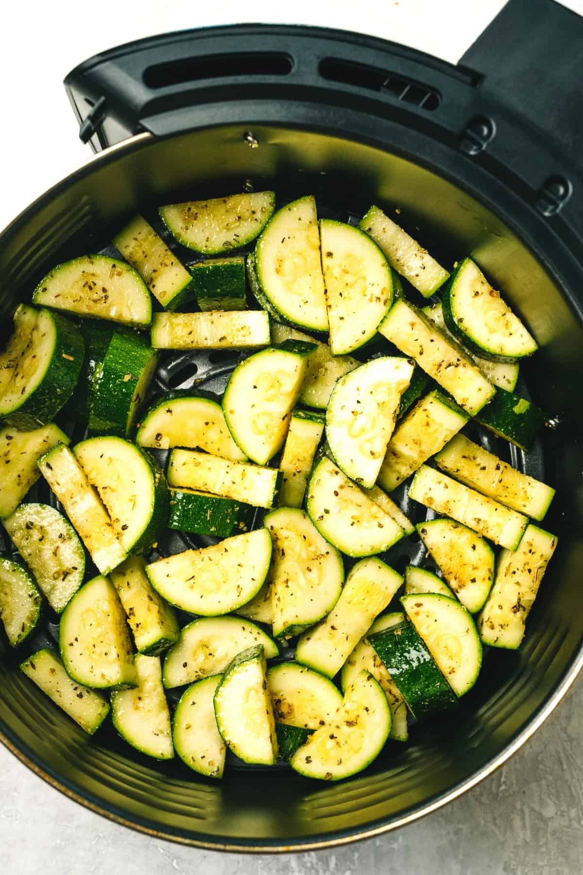 air fryer zucchini in an air fryer basket