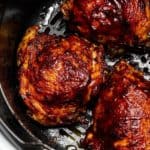 air fryer bbq chicken thighs in the ninja foodi air fryer cooking basket