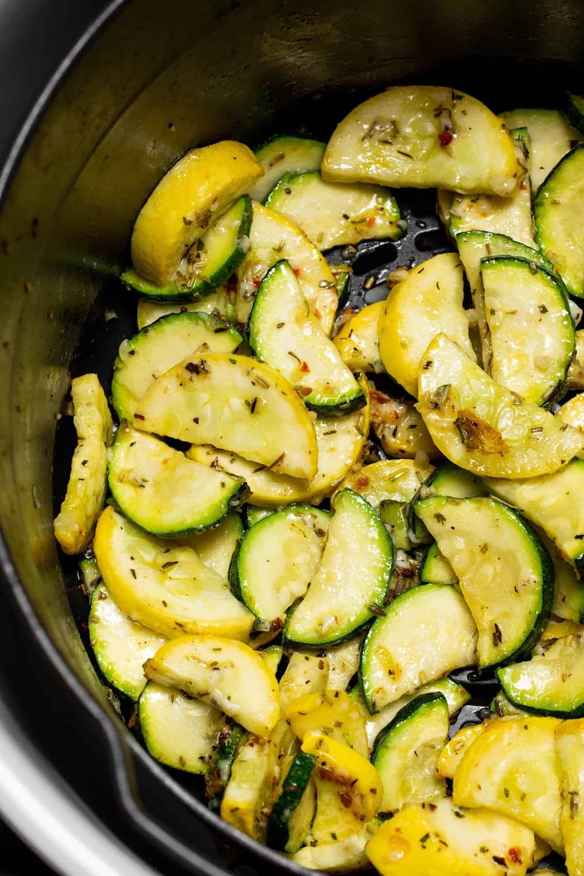 air fryer squash in the Ninja Foodi air fryer basket half way cooked