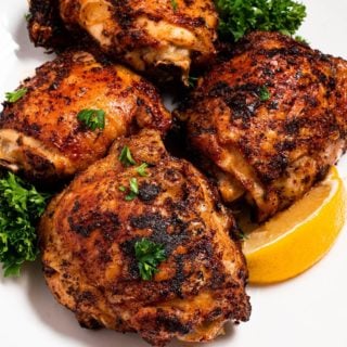 air fryer cajun chicken thighs on a plate