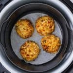 air fryer crab cakes in the Ninja Foodi with parchment paper