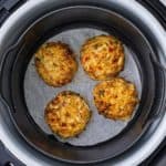 air fryer crab cakes in the Ninja Foodi with parchment paper