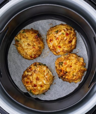 air fryer crab cakes in the Ninja Foodi with parchment paper