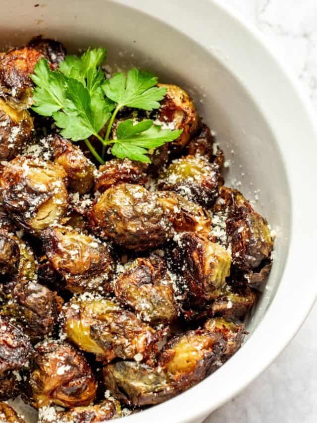 air fryer frozen Brussels sprouts in a white bowl