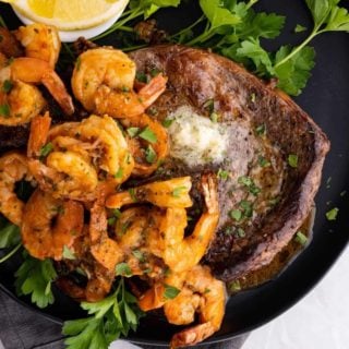 air fryer surf and turf on a black plate