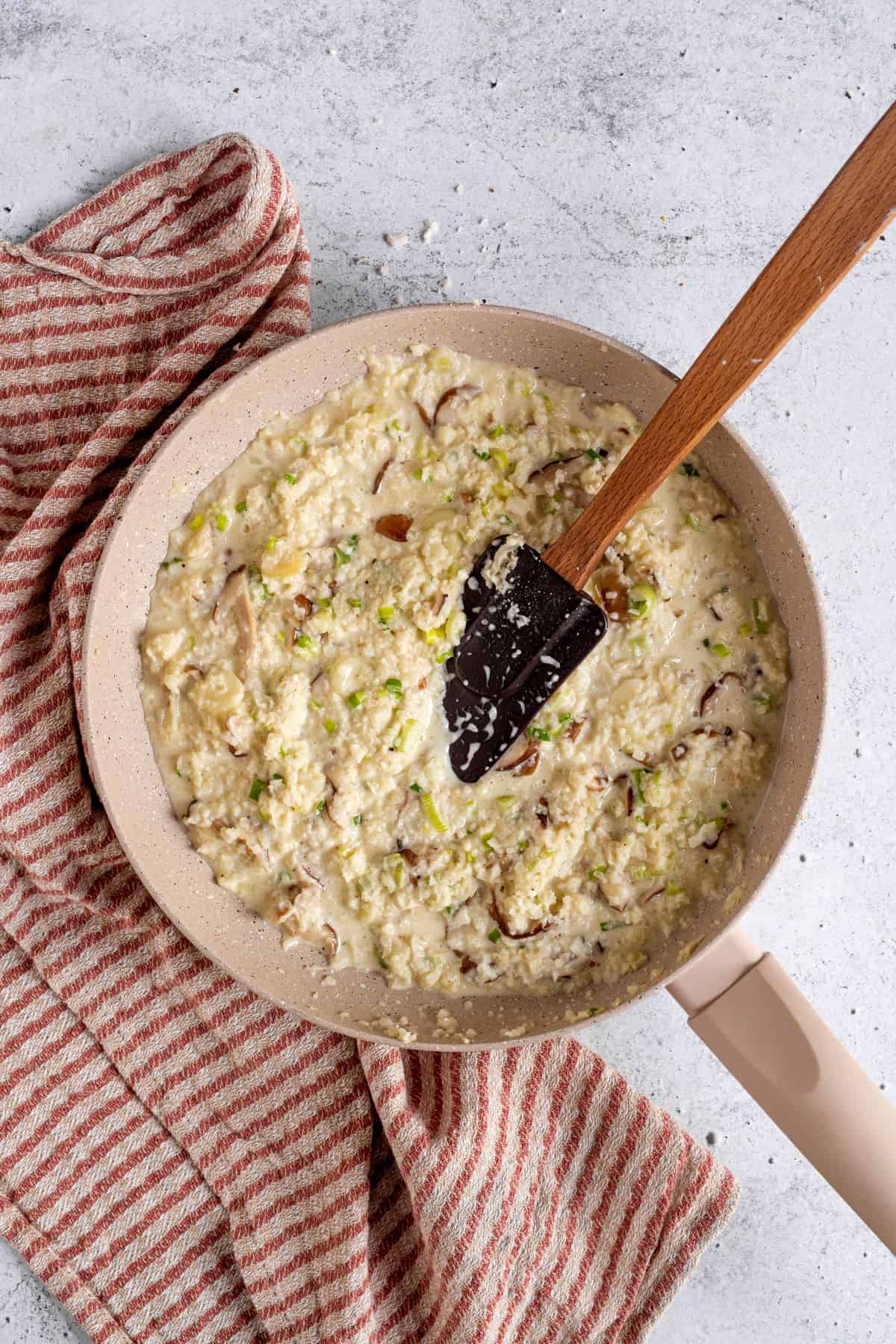 mixing Mushroom Risotto on a pan