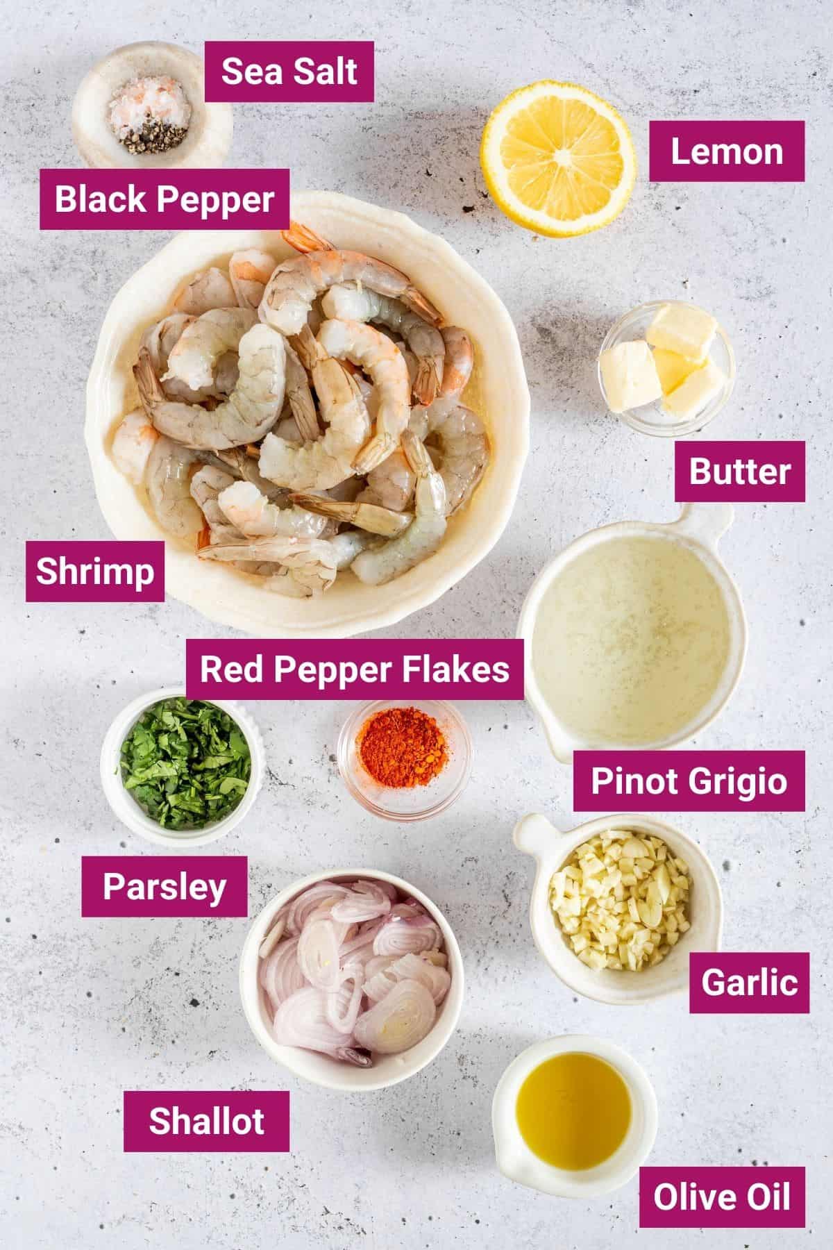 condiments, shrimp, garlic, shallots, lemon, pinot grigio on separate bowls