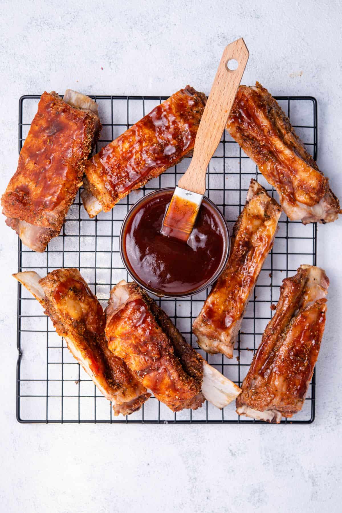 brushing bbq sauce on the pork bbq ribs
