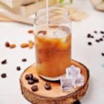 Cold brew latte recipe in a glass with ice cubes
