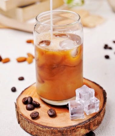 Cold brew latte recipe in a glass with ice cubes