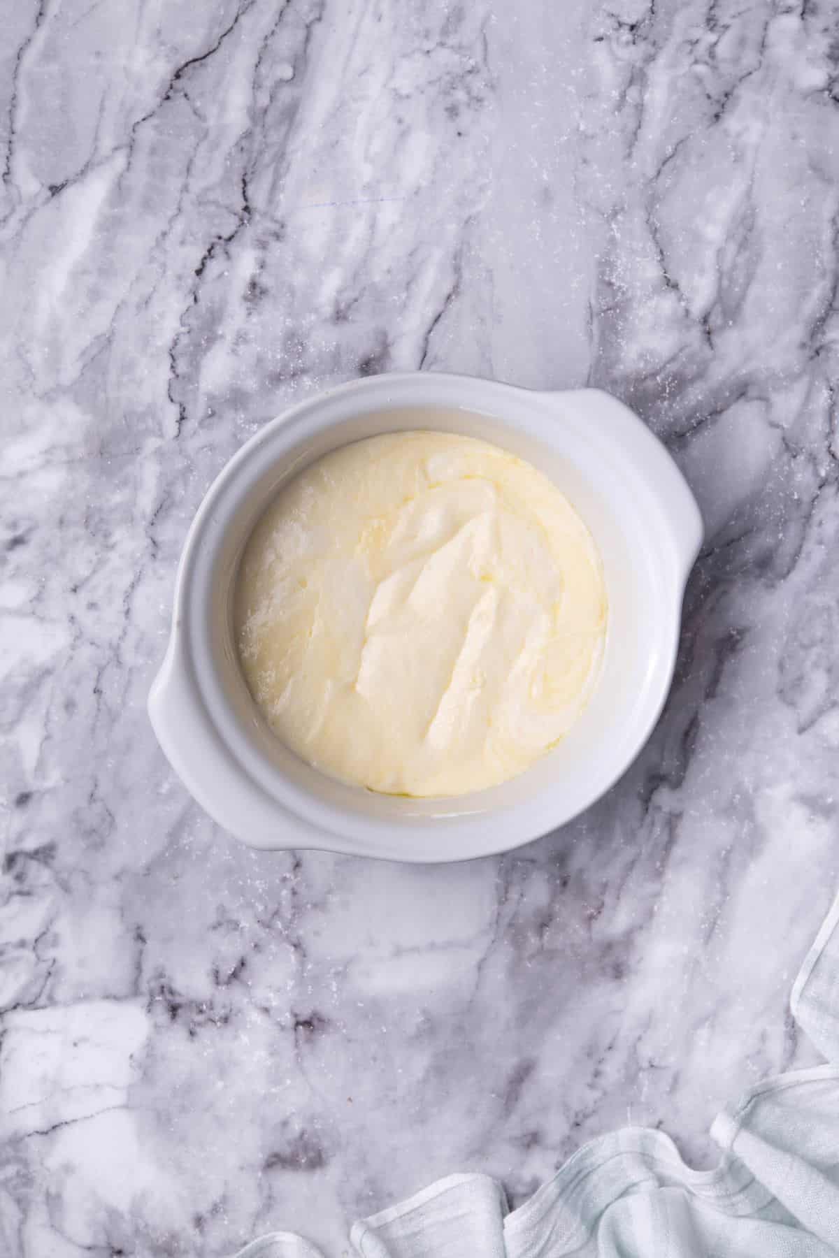 melted parmesan cheese on a bowl