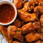 yummy Honey Sesame Ghost Pepper Wings on a parchment paper