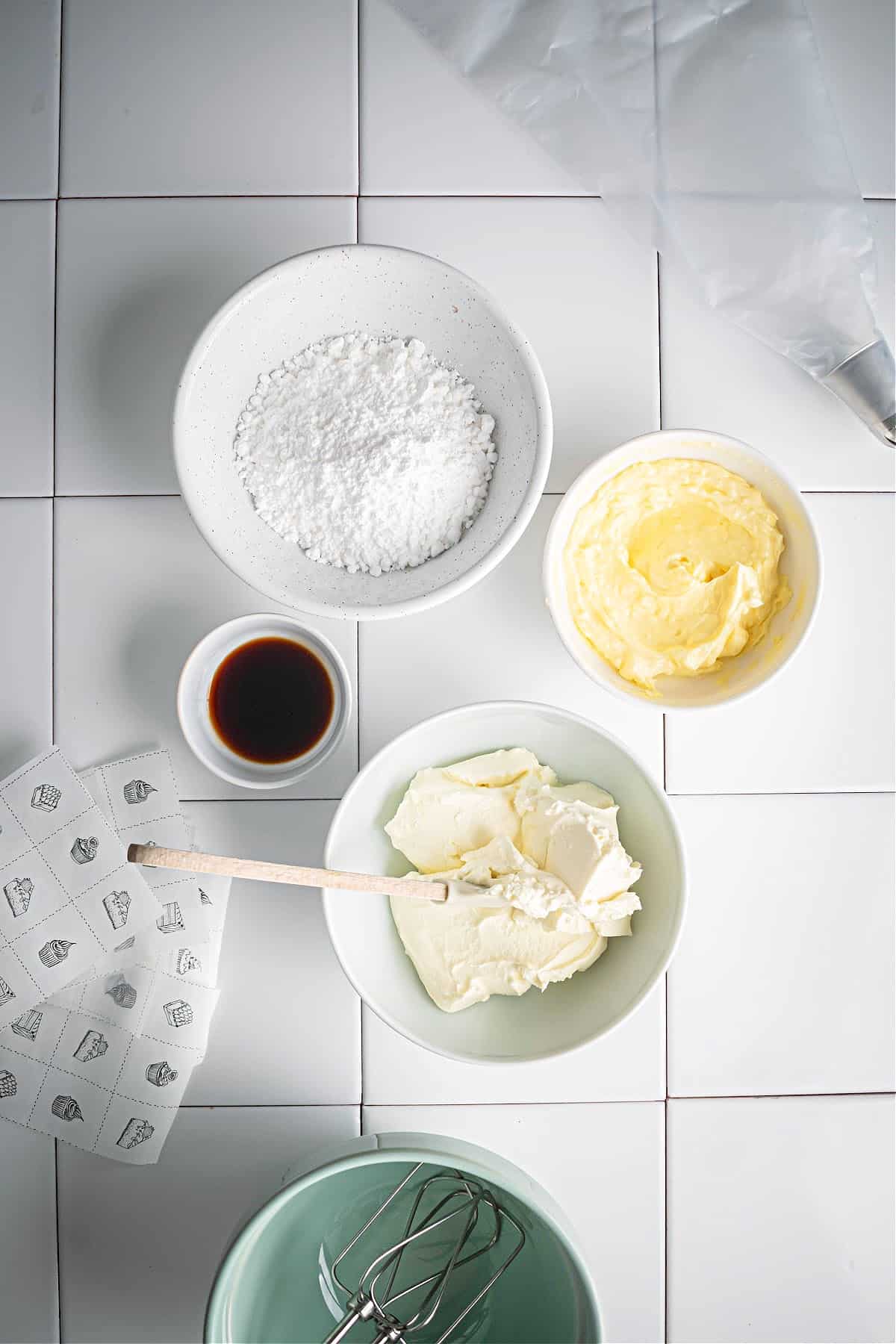 butter, cream cheese, vanilla and powdered sugar on separate bowls