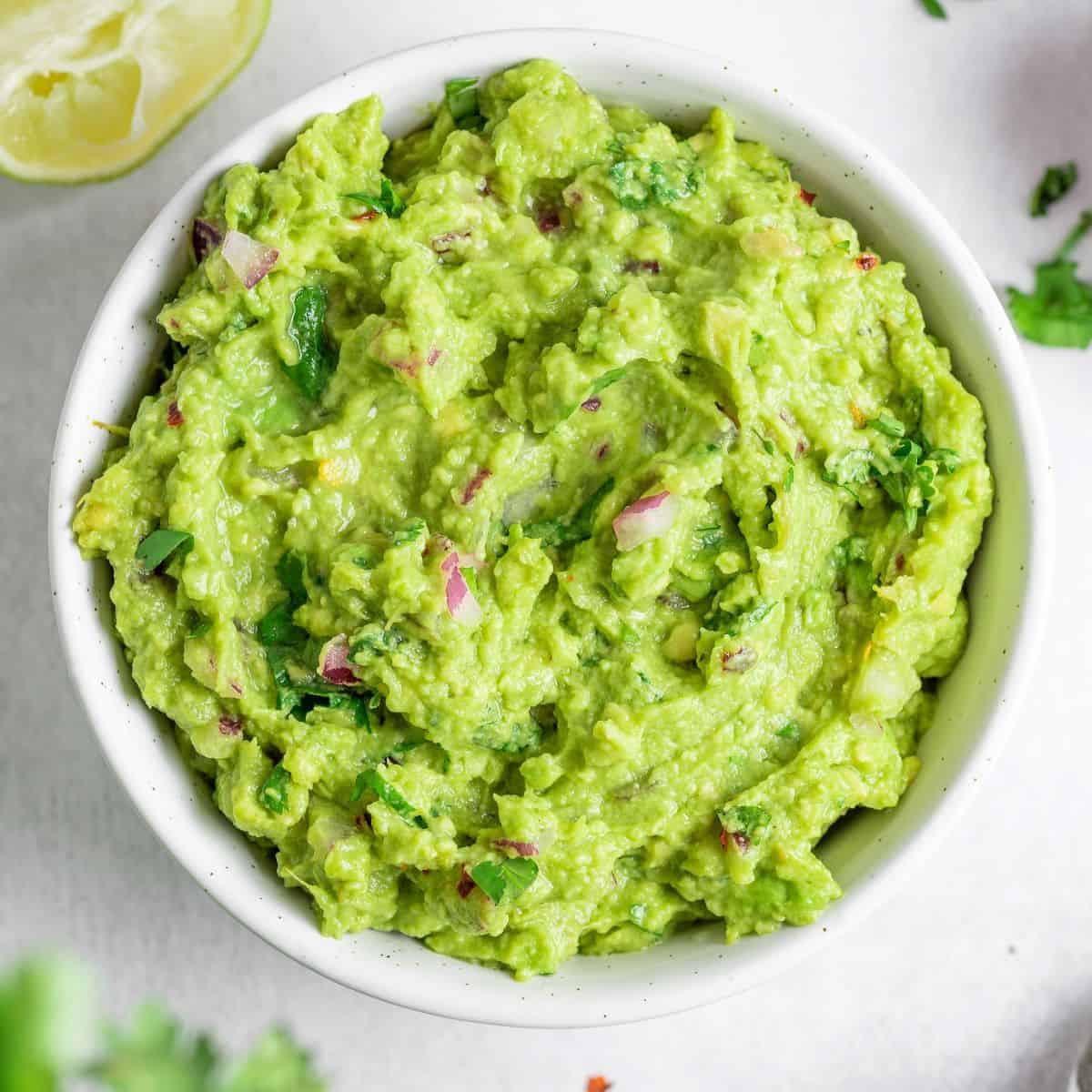 delicious Keto Guacamole on a white bowl