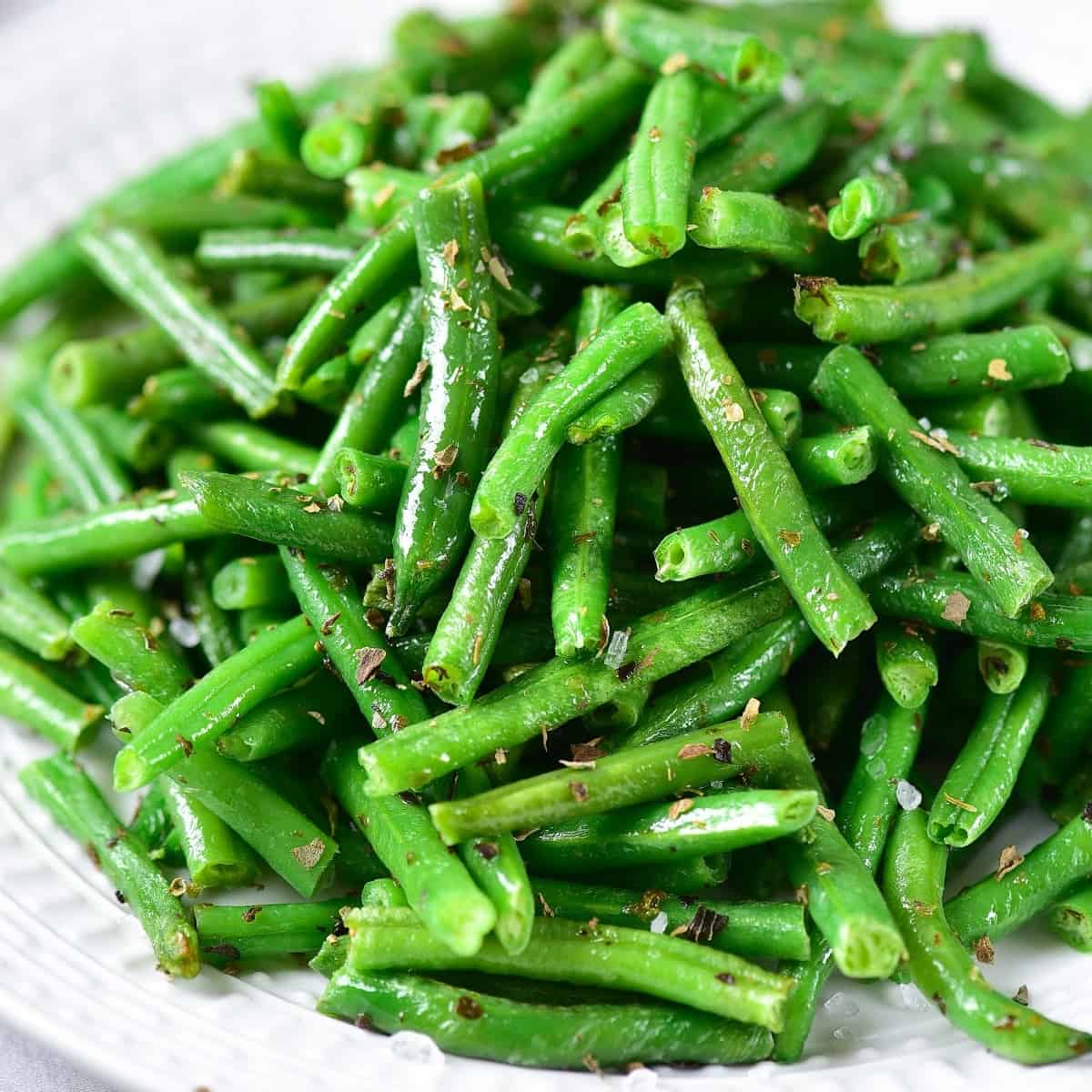 frozen green beans in the air fryer on a plate