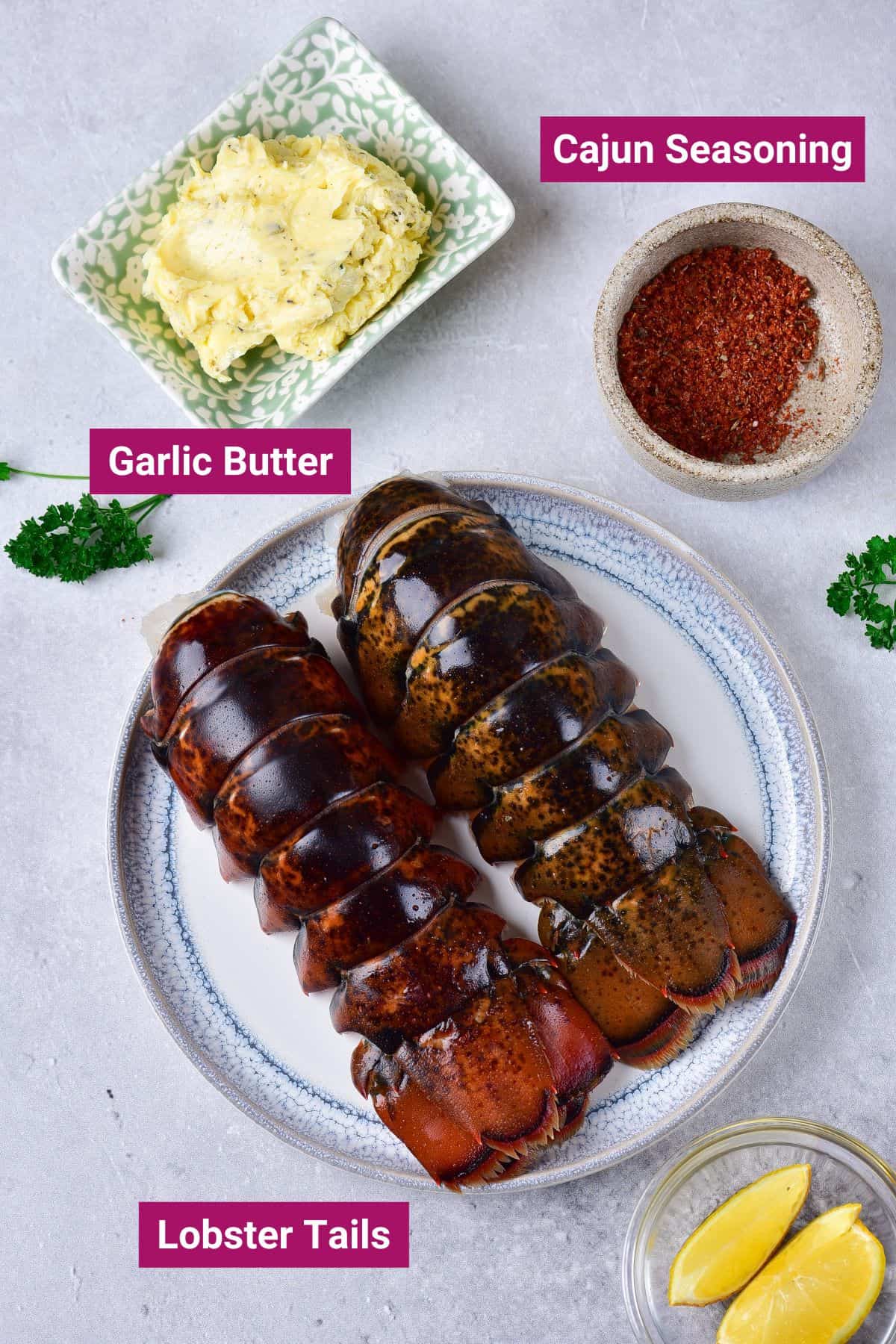 ingredients needed to make ninja air fryer lobster tails: cajun seasoning, garlic butter, lobster tails on separate plates