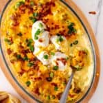 Loaded Cauliflower on an oblong bowl on a large bowl