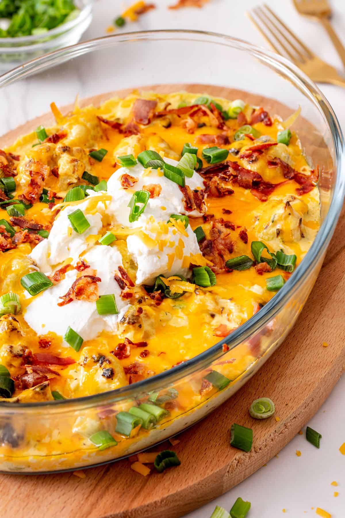 Loaded Cauliflower with sour cream and green onions on top