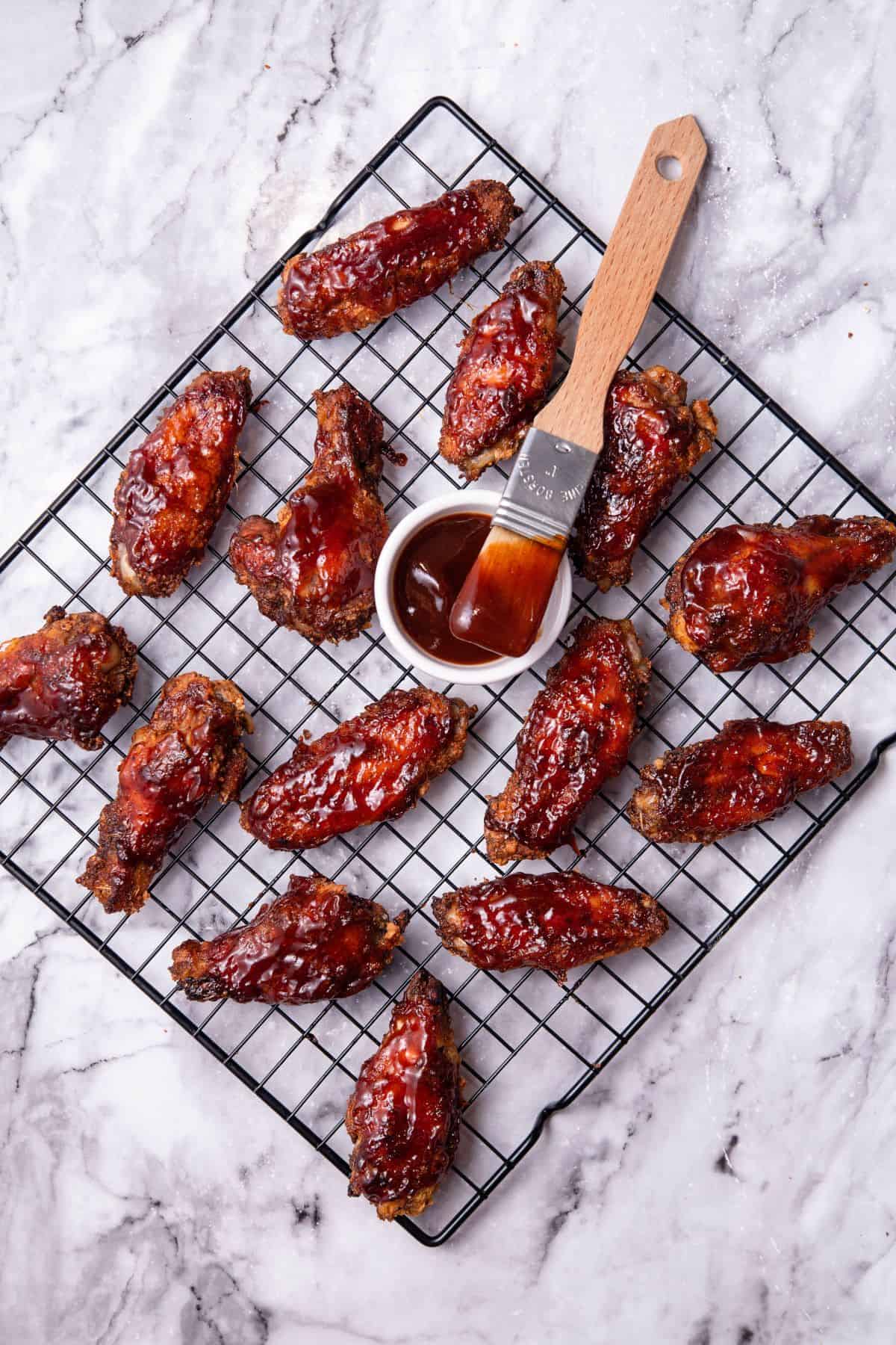 Oven Baked BBQ Chicken Wings on a cooling wire rack