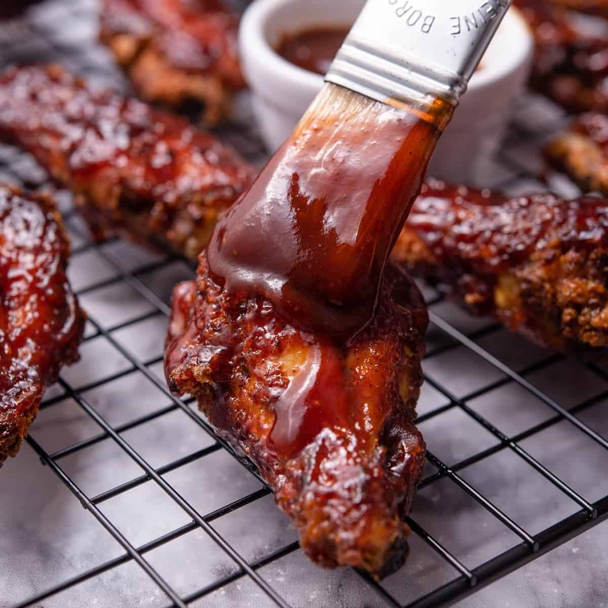 crispy baked bbq chicken wings on a cooling rack