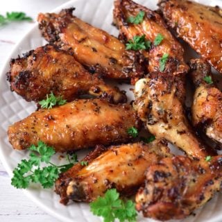 close up shot of marinated chicken in a plate