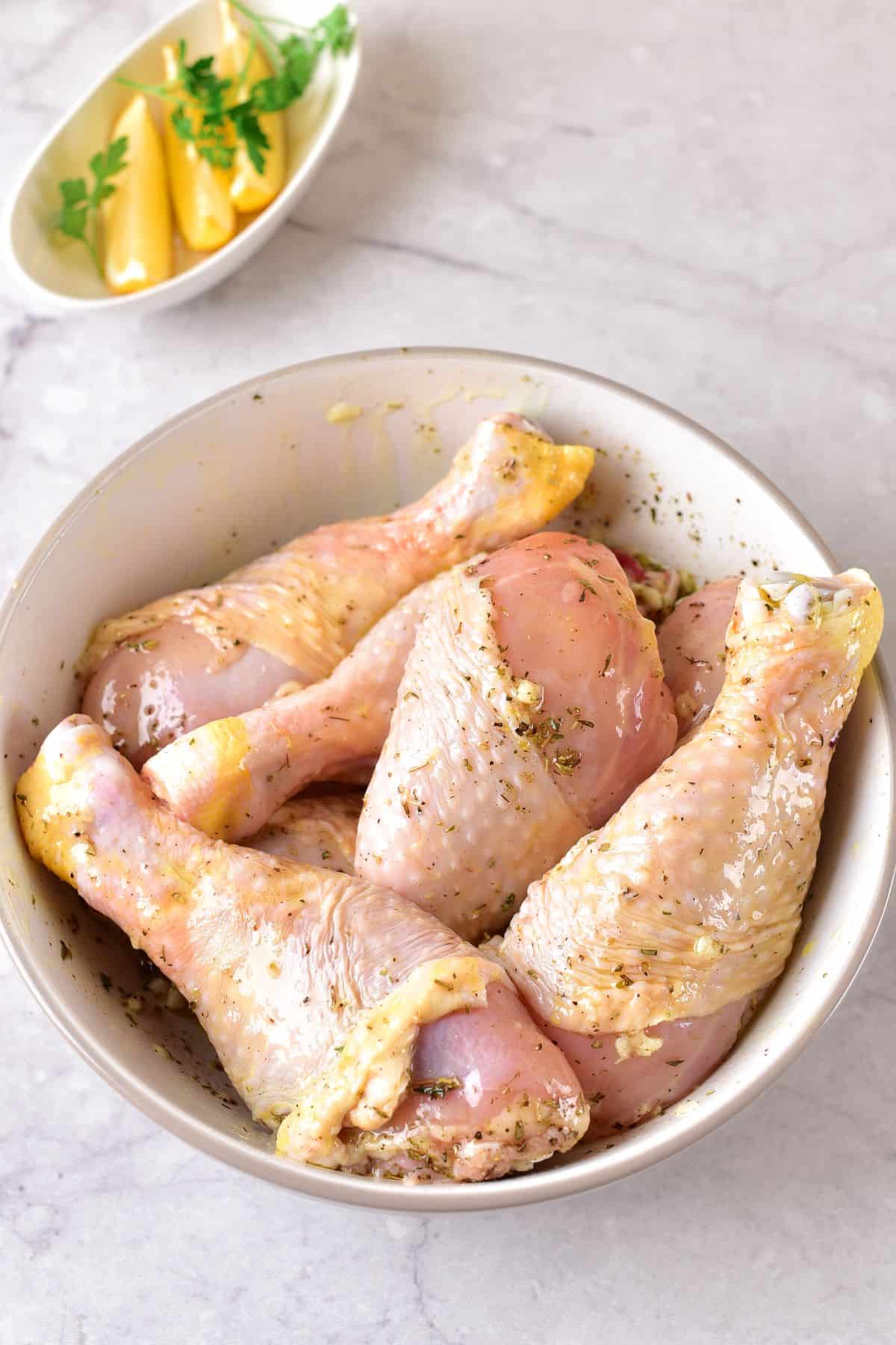 marinated drumsticks on a bowl