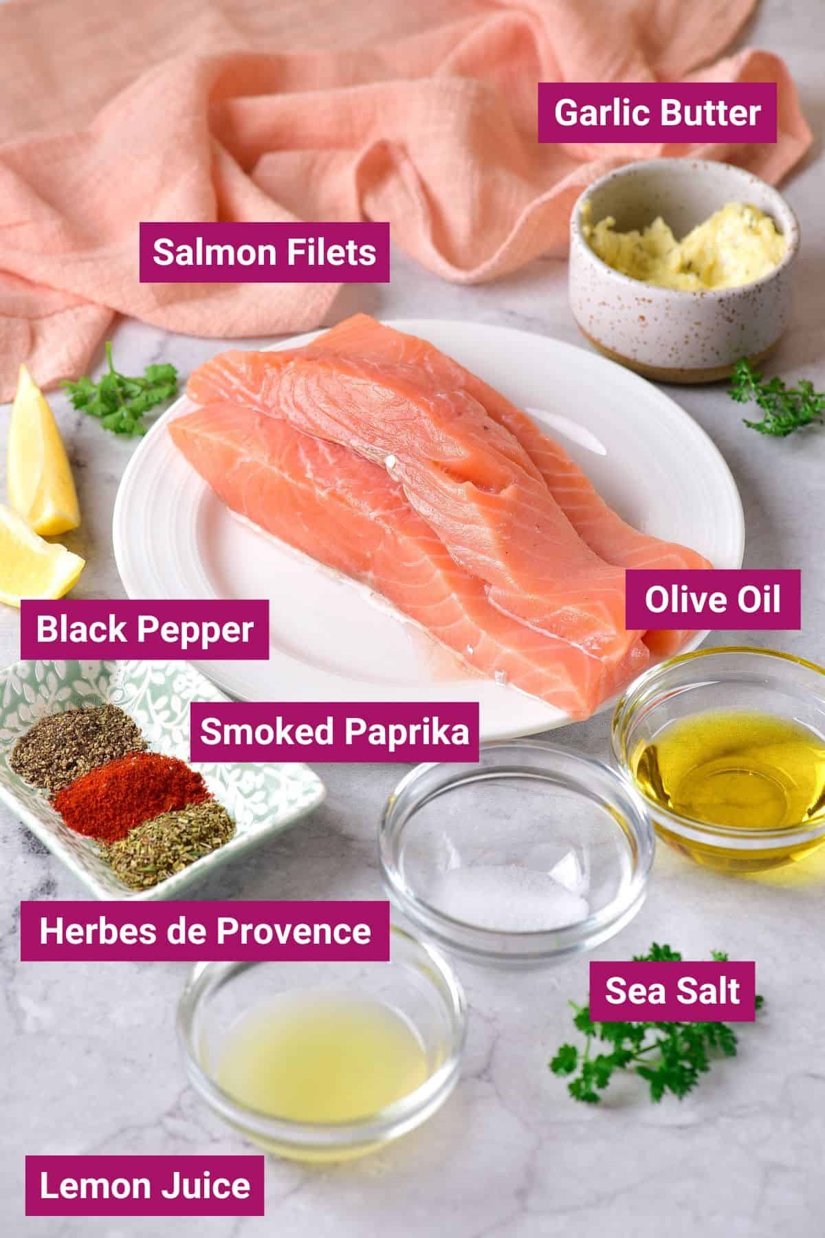 salmon filets, garlic butter, spices, olive oil, salt and lemon juice on separate bowls
