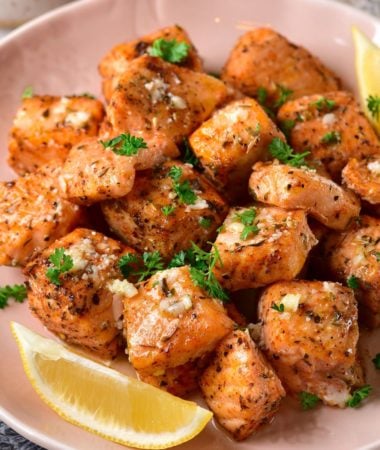 Salmon Bites with slices of lemon on the side