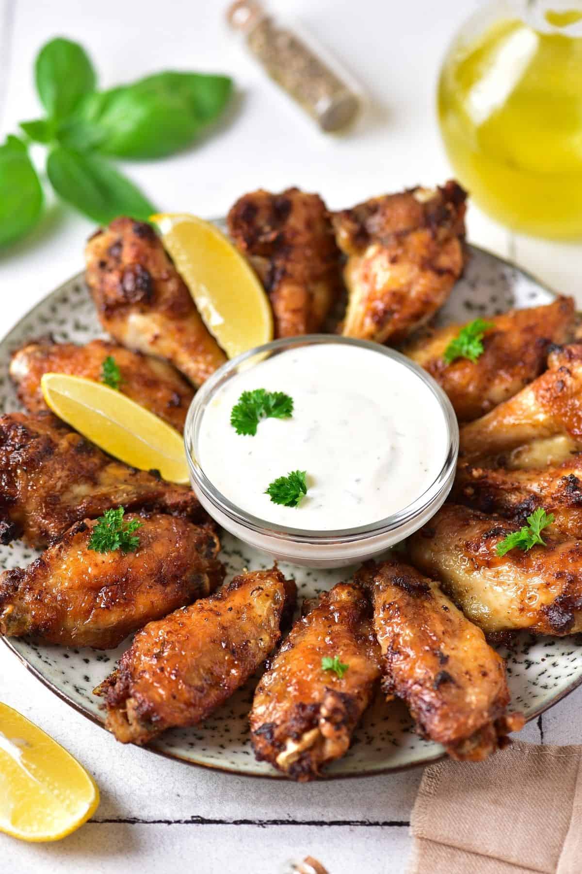 Ranch Wings with dip on a plate