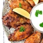 yummy ranch wings with slices of lemon on a plate