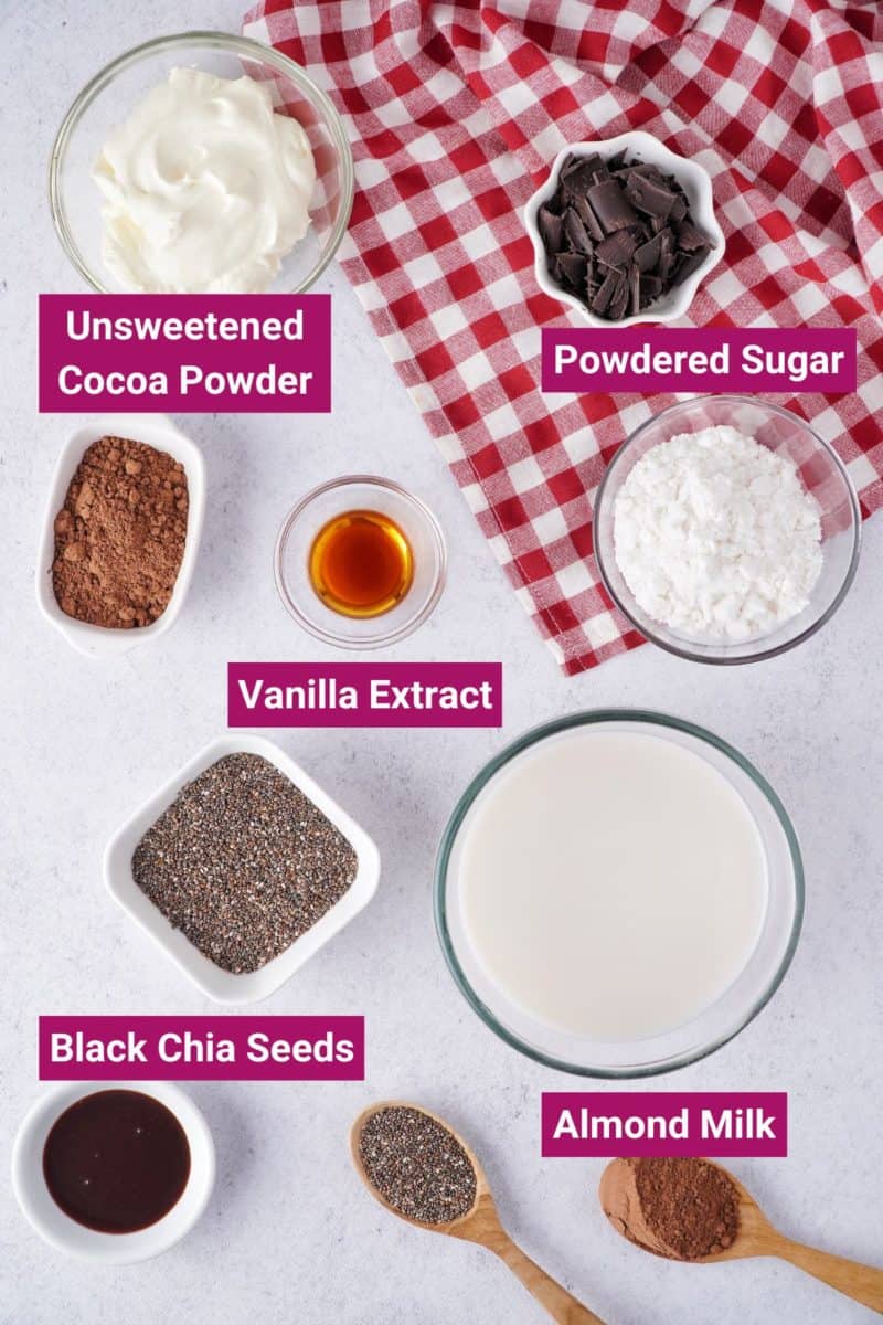 ingredients needed to make low caeb chocolate chia pudding: black whole chia seeds, powdered sugar, almond milk, unsweetened cocoa powder, vanilla extract in separate bowls