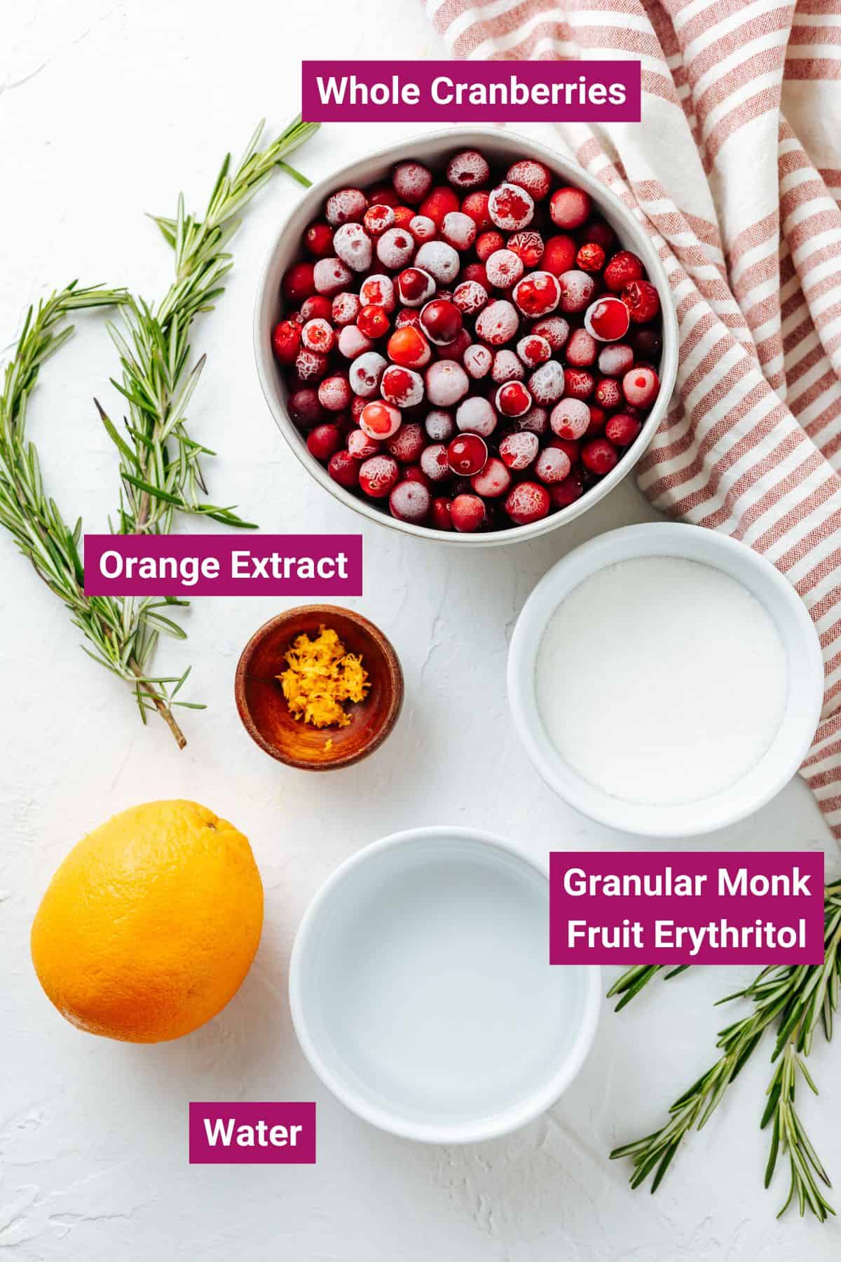 ingredients needed to make keto cranberry sauce without sugar: whole cranberries, orange extract, sugar substitute and water on separate bowls