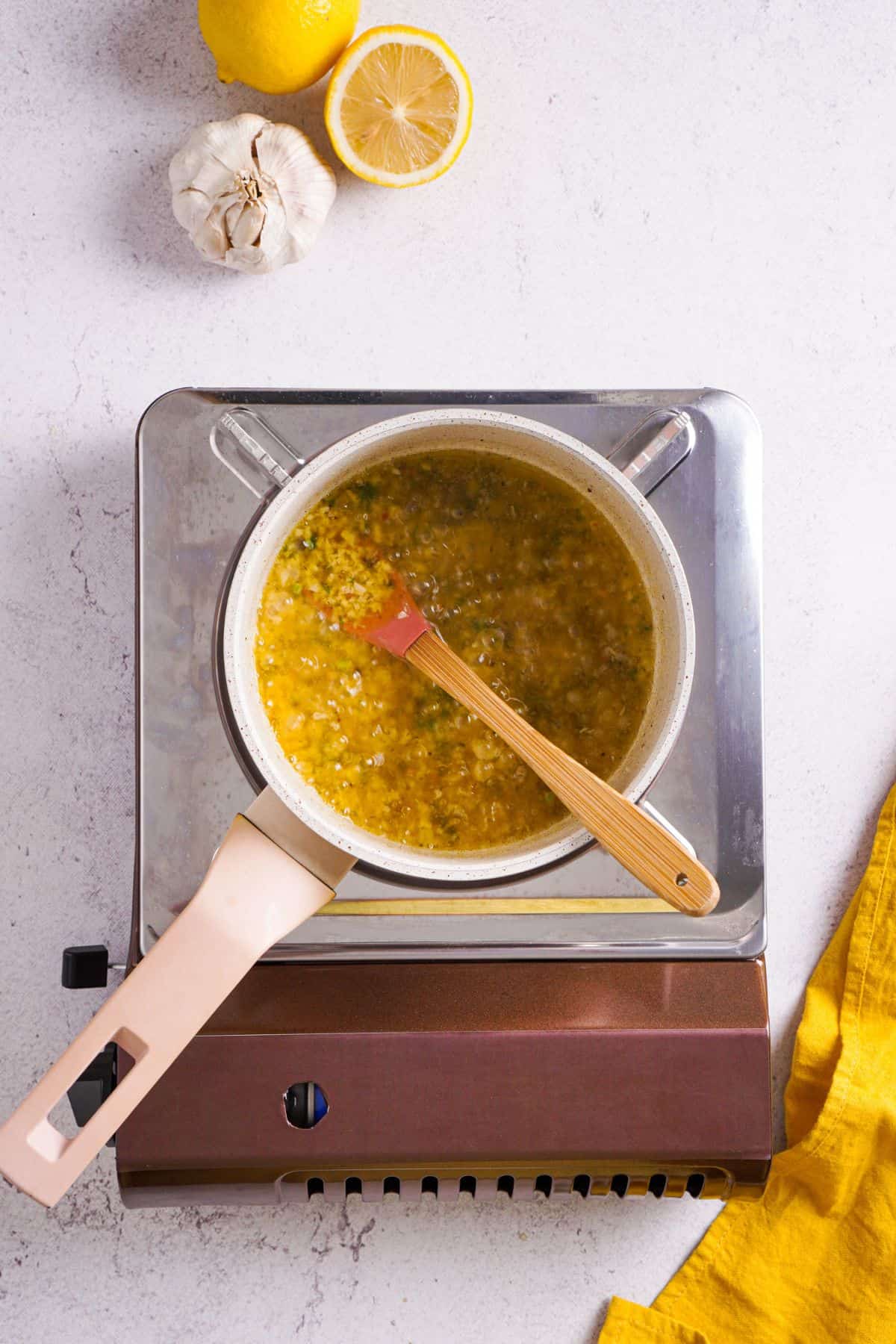 cooking Lemon Garlic Butter Sauce on a pan