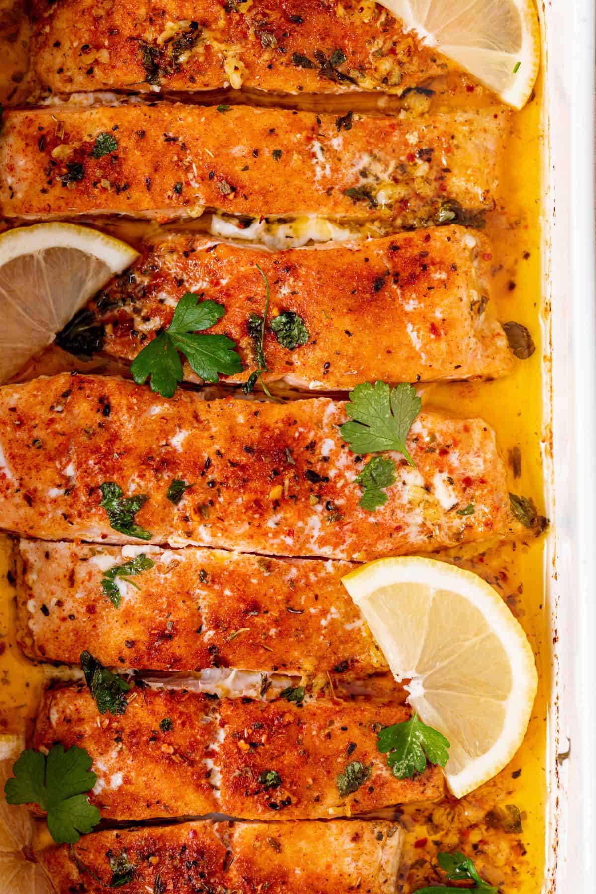 baked salmon topped with slices of lemon