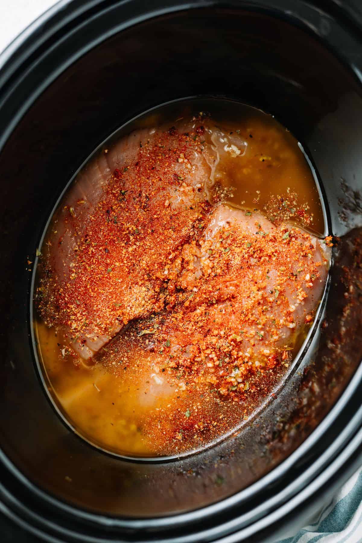 turkey tenderloin and all the marinade contents on the slow cooker