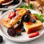 Keto Stuffed French Toast topped with blueberries and maple syrup