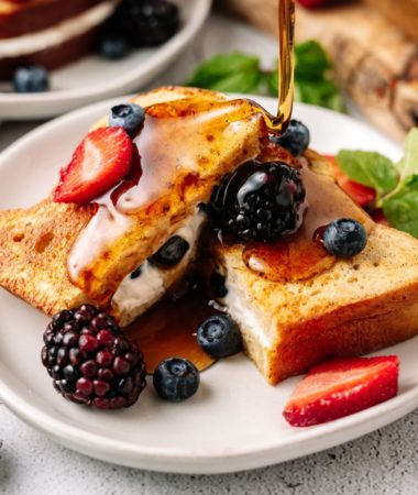 Keto Stuffed French Toast topped with blueberries and maple syrup
