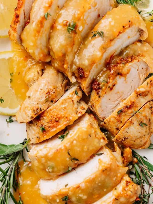 close up of slow cooker turkey tenderloin recipe on a plate with gravy