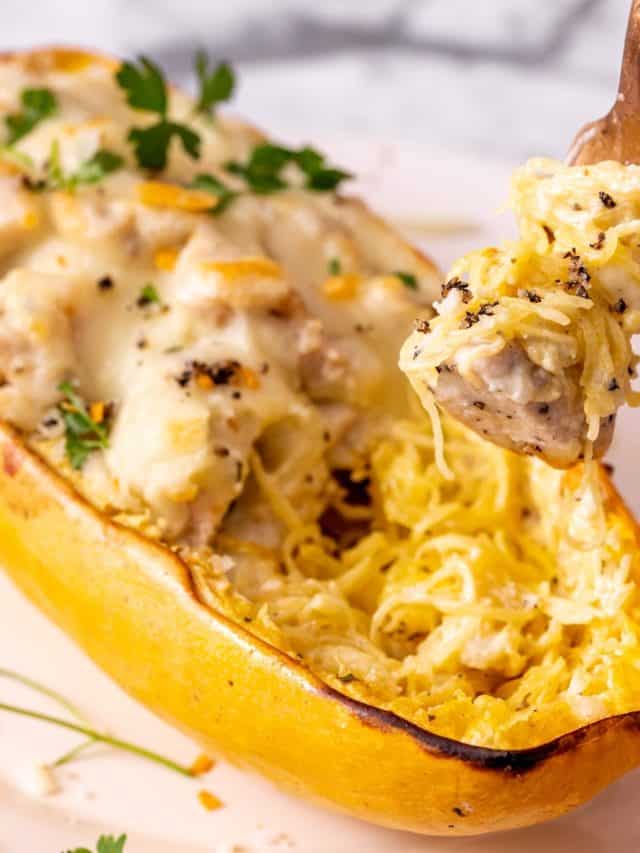 chicken alfredo stuffed spaghetti squash on a plate