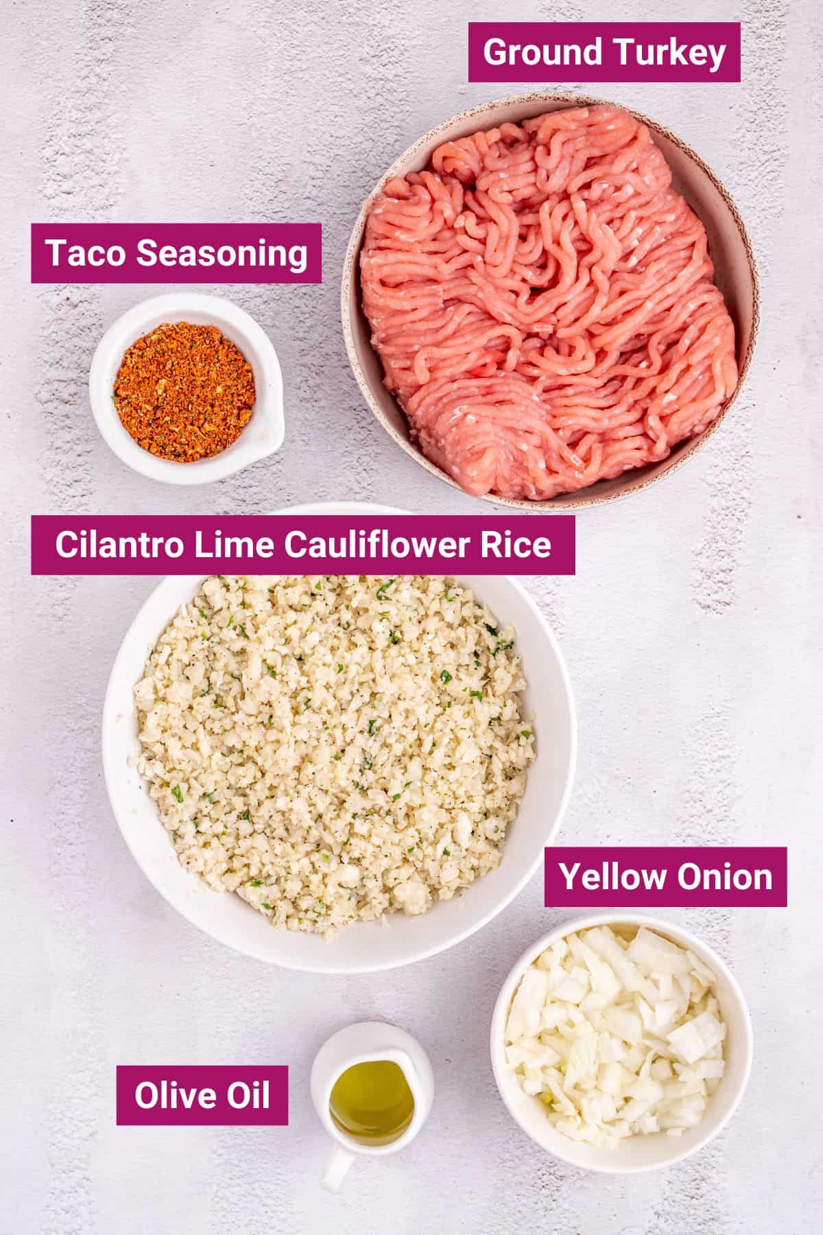 ingredients for a turkey taco bowl like Ground Turkey, Yellow onion, homemade Taco Seasoning, Olive Oil, and Cilantro Lime Cauliflower Rice in separate bowls