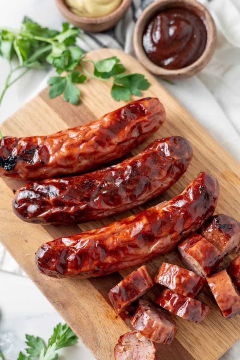 air fried Chicken Sausages on a wooden board