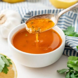 homemade cajun garlic butter sauce in a small bowl