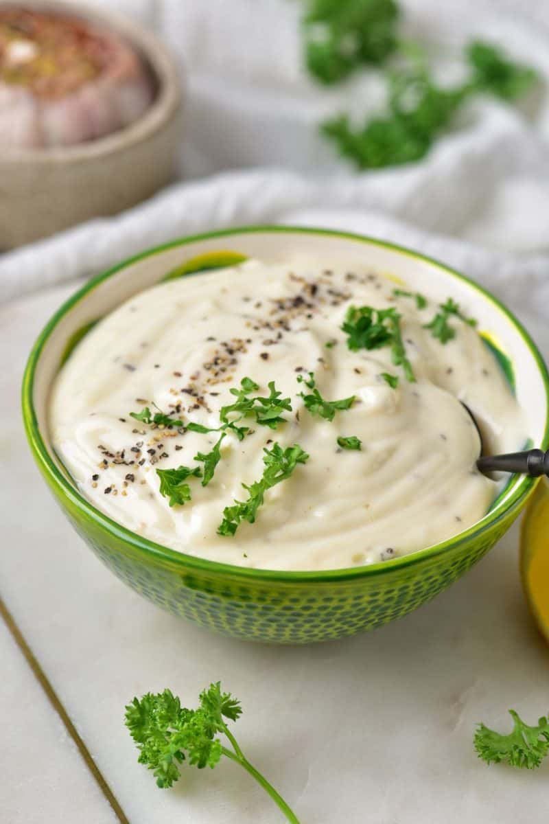 Lemon Garlic Aioli on a beautiful green bowl