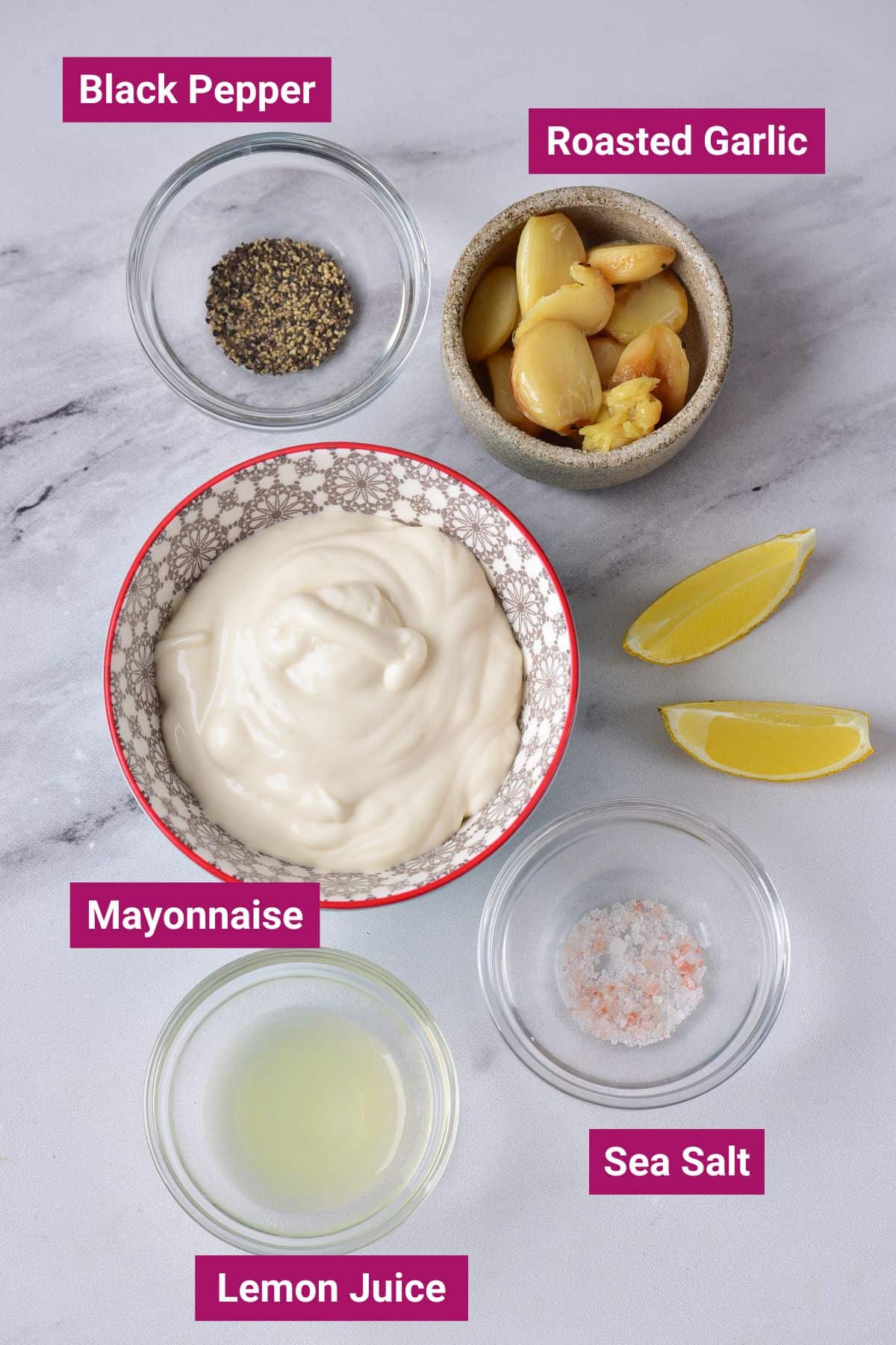 ingredients to make lemon garlic aioli in separate small bowls