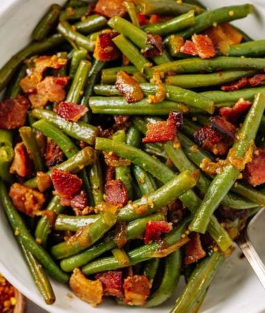 instant pot southern green beans with bacon in a white bowl
