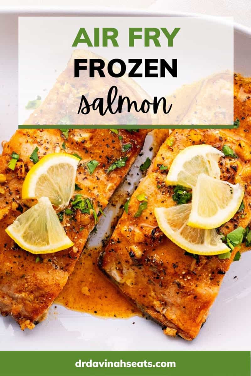 A poster with a picture of two salmon fillets on a plate, with a banner that says "Air Fry Frozen Salmon"