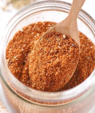 bbq seasoning in a jar with a spoonful scooped out