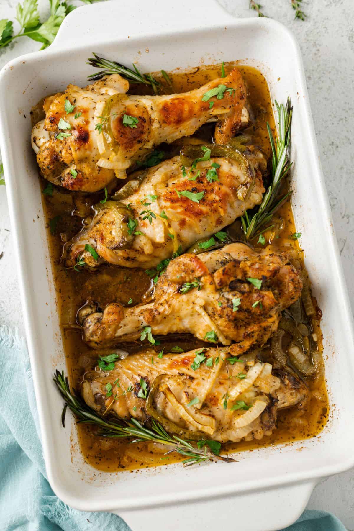 Overhead view of four baked turkey wings in a baking dish