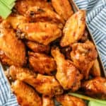Succulent Slow Cooker Buffalo Wings, served alongside crisp celery sticks and a creamy mayo dip for a perfect balance of spicy and cooling flavors